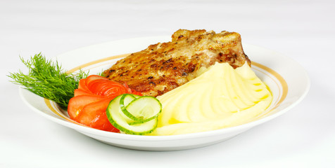 A mouth watering tenderloin steak with fresh vegetables