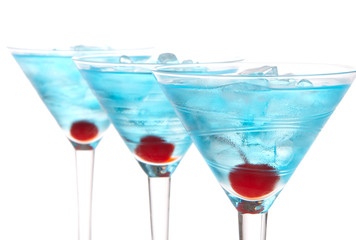 Blue martini cocktails row composition with alcohol