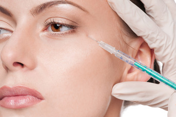 Cosmetic injection in woman's face