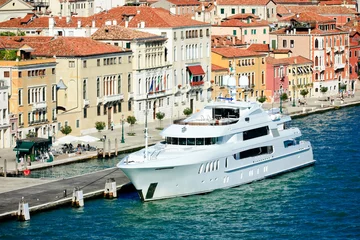Fototapeten luxury yacht docked at Giudecca canal in Venice © Elena Zarubina
