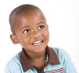 Adorable 3 year old black or African American boy smiling