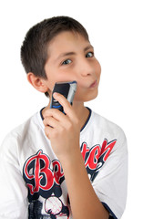 kid boy holding shaver razor and shaving cheek