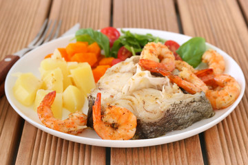 Boiled fish with shrimps and vegetables
