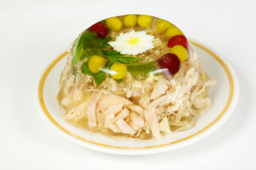Aspic from chicken meat decorated with eggs and parsley