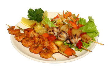 seafood barbecue with salad and lemon