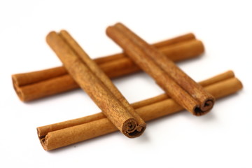 Cinnamon sticks on white