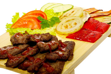 Grilled meat with fried vegetable salad