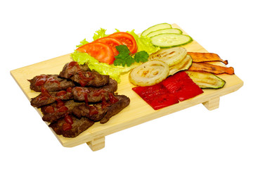 Grilled meat with fried vegetable salad