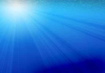Rays of light underwater,blue background
