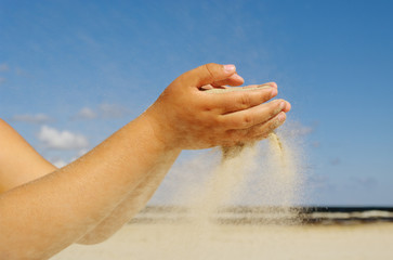 Fototapeta na wymiar Sand in the hand.