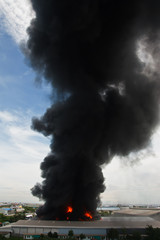 Fire burning and black smoke over cargo