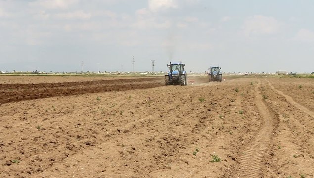 Agricultural land and tractor image