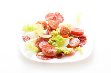 salad with salami and tomato