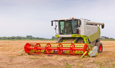 A closeup of a combine in the field after work