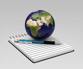 Die Weltkugel auf einem Notizbuch