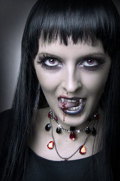 Fashion portrait of woman vampir