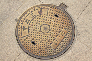Obraz premium city manhole covers