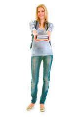 Full length portrait of teen girl with schoolbag giving books