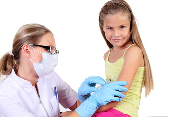 Doctor doing vaccine injection to child