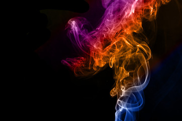 Colorful smoke abstract curly on black background