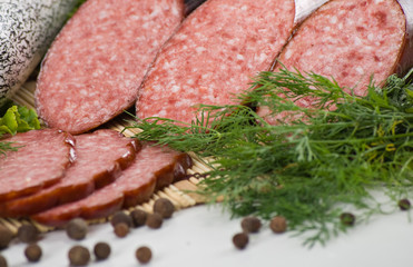 Sausages and ham with lettuce and tomatoes