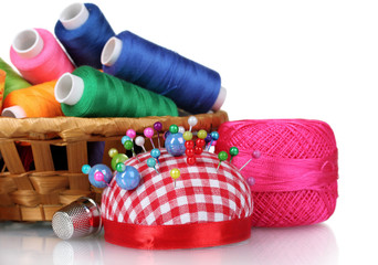bright threads in basket and cushion for needles