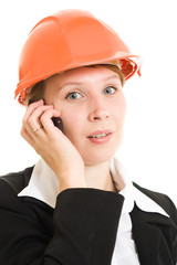 Businesswoman in a helmet on a white background.