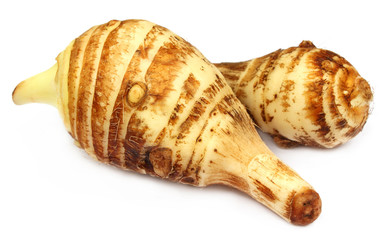 Edible taros over white background