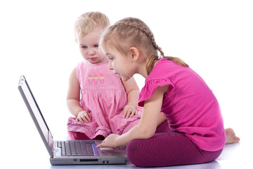 Kids playing computer game on laptop
