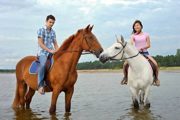 Man and a woman on horseback