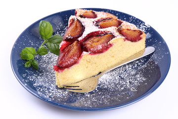 Plum Pie - a piece covered with powder sugar with mint