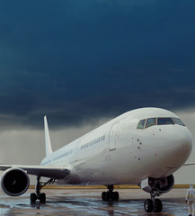 Airplane, delayed flight, rain storm, airport.