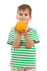 Boy holding oranges