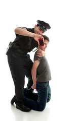 Happy policeman with apprehended teen boy