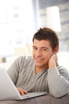 Young man with laptop computer