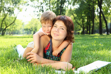 Mother with little son in the park