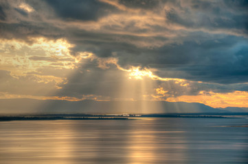 sunset behind the back cloudy sky (HDR)