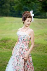 Princess in an vintage dress in nature