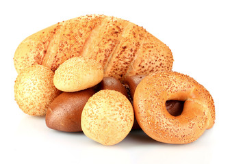 Tasty bread with sesame seeds and buns isolated on white