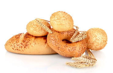 bread and buns with sesame seeds and spikelets isolated on white