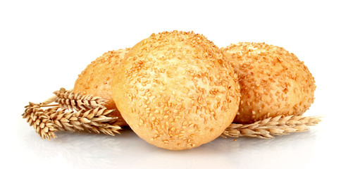 buns with sesame seeds and spikelets isolated on white