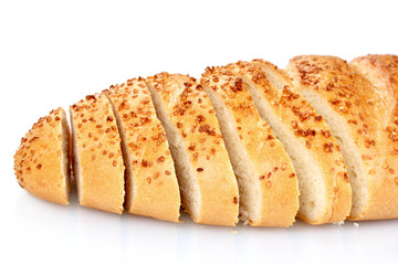 tasty sliced bread with sesame seeds isolated on white