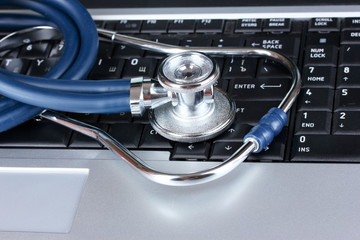 Medical stethoscope and notebook
