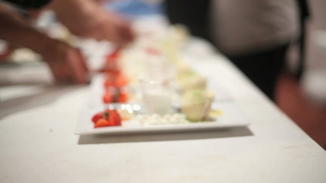 catering company makes large quantities of desserts to be served