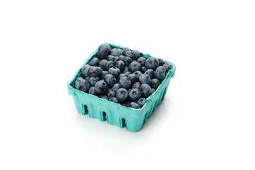 Pint container of blueberries on white