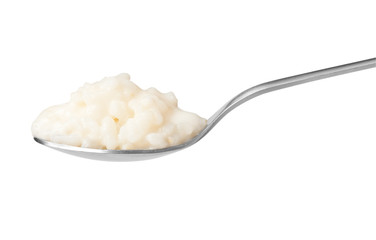 Pure rice pudding on spoon
