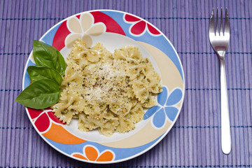 Pasta with Italian pesto sauce with basil