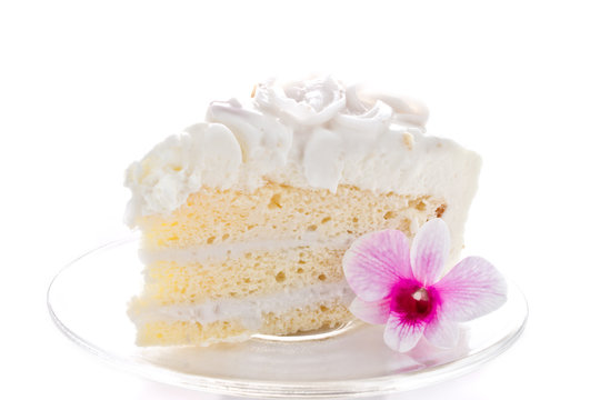 A Piece Of Coconut Cake With Orchid