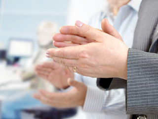 Business team applauding in the meeting room