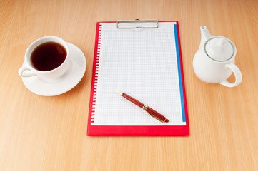 Binder with blank page and tea